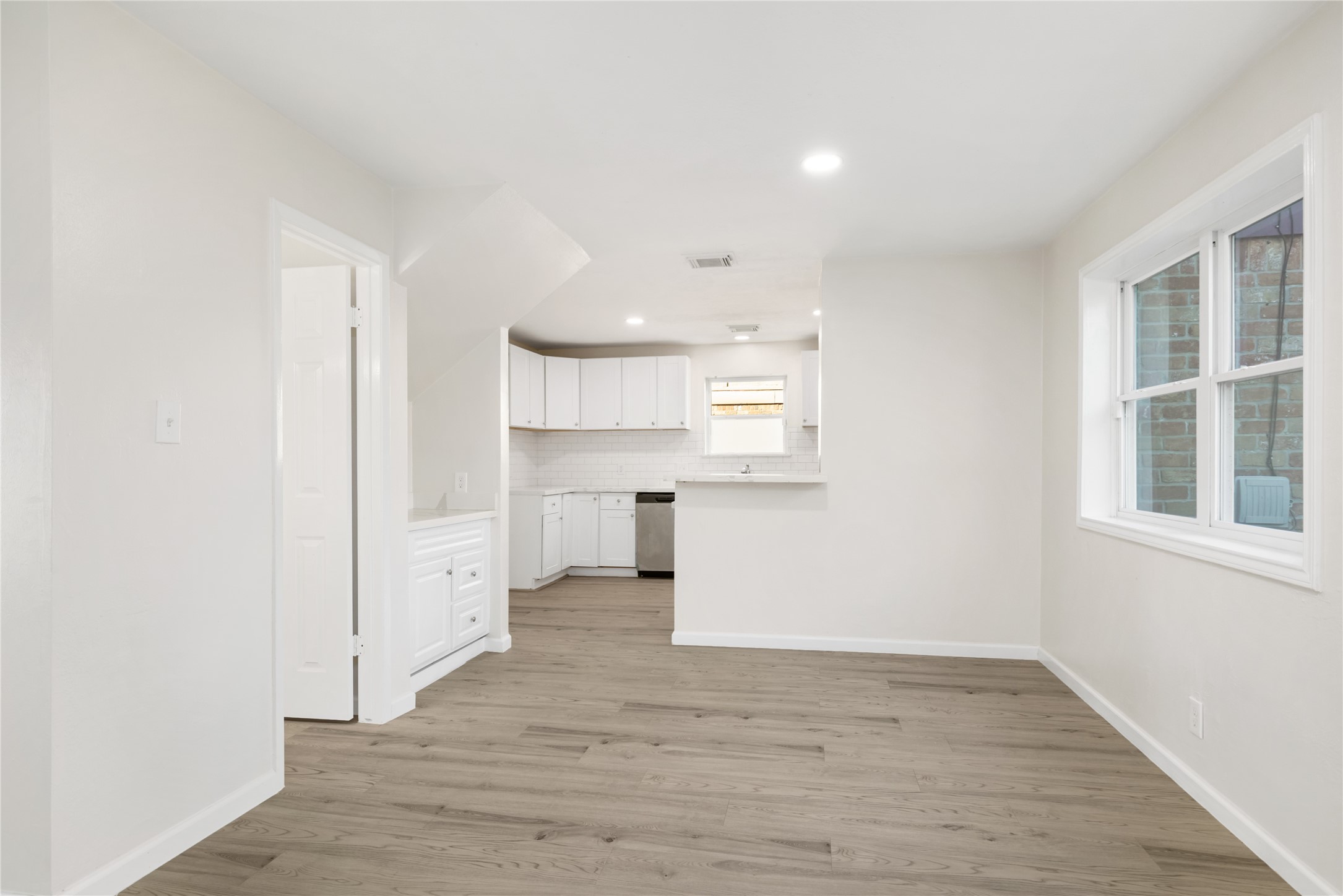24118 Spring Mill Lane Spring, TX 77373 - Photo 9 of 24 a view of kitchen and wooden floor
