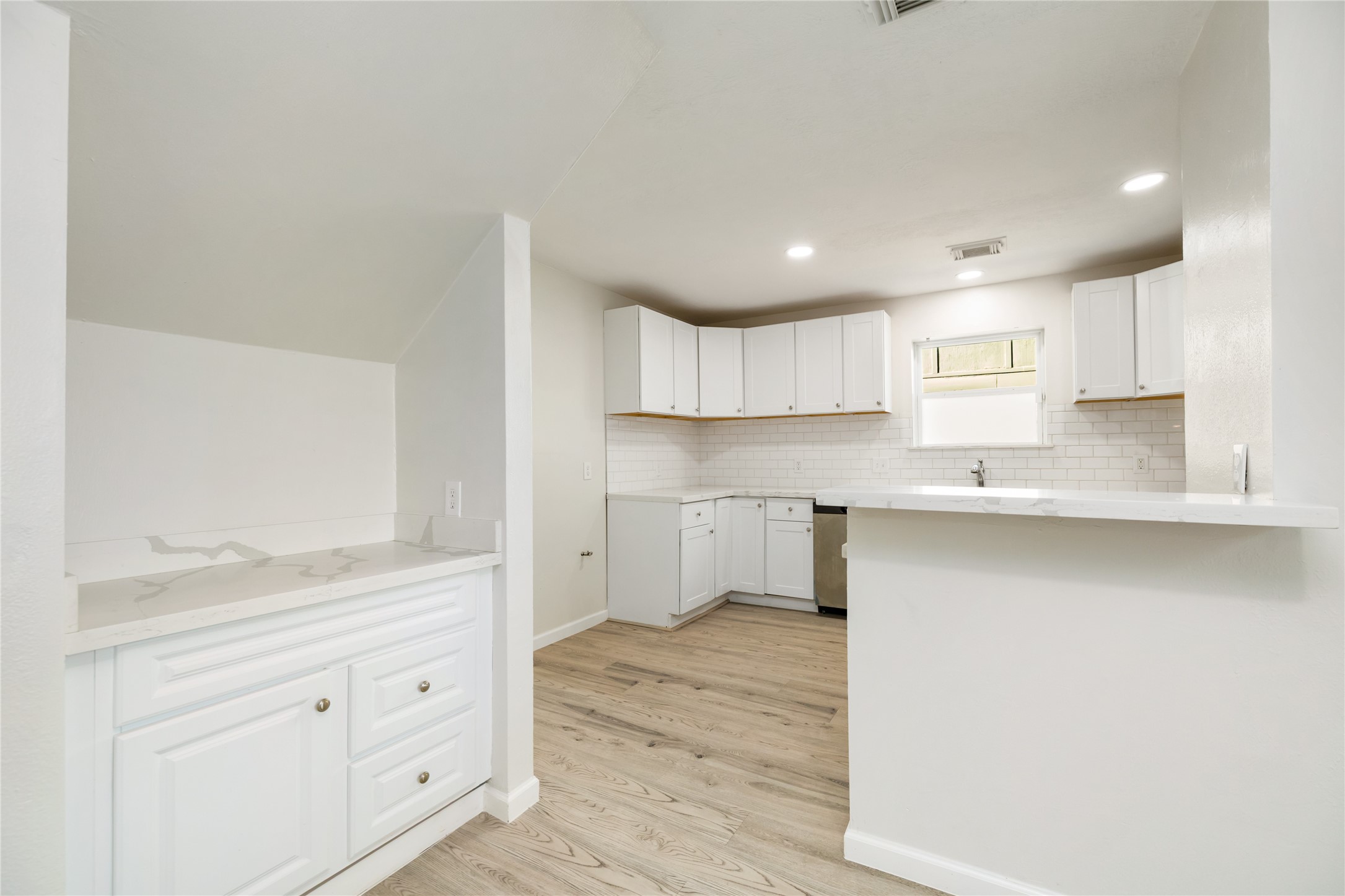 24118 Spring Mill Lane Spring, TX 77373 - Photo 10 of 24 a kitchen with granite countertop white cabinets and a sink