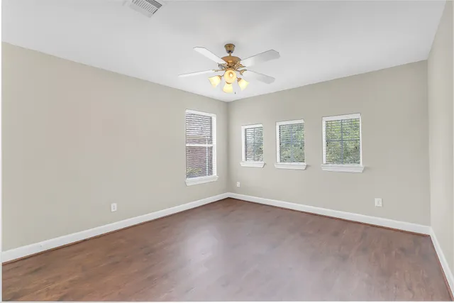 a bathroom with a double vanity sink mirror and toilet