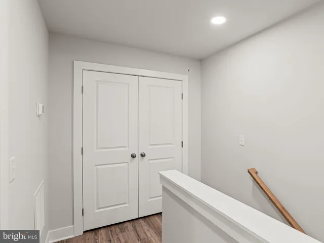 a bathroom with a white toilet and a sink