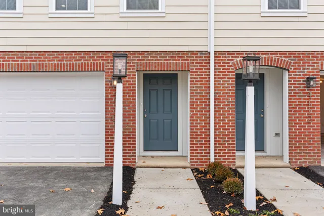 a front view of a house with a garage