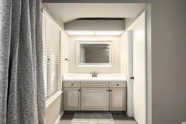 a view of house with backyard