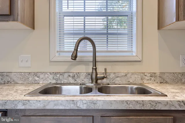 a close view of a sink and a window