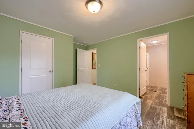 a bedroom with a bed and a dresser