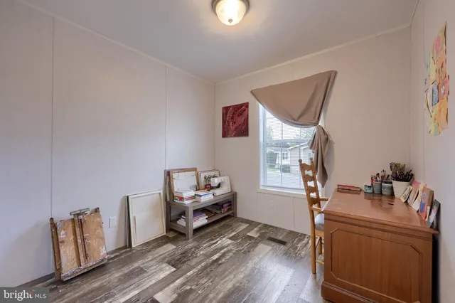 a room with furniture and wooden floor