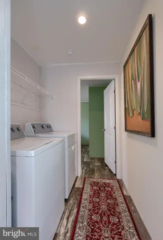 a view of hallway with washer and dryer