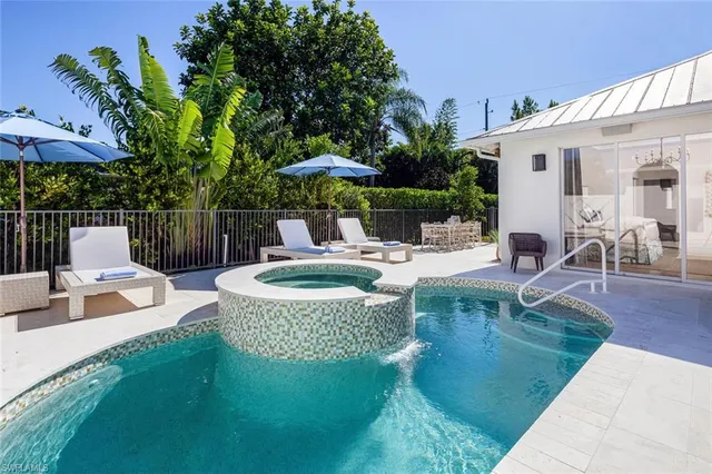 a view of a swimming pool with a patio