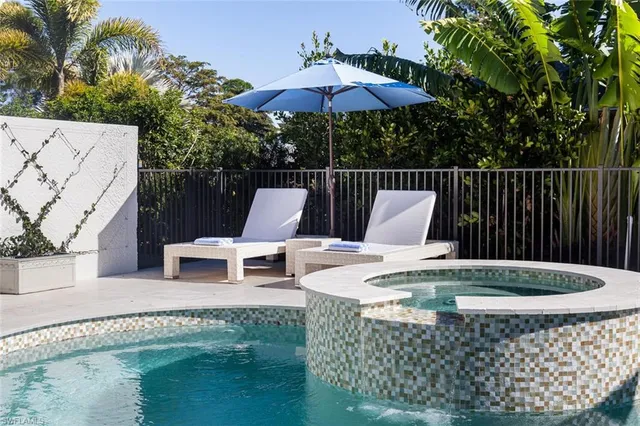 a view of a chairs and table in the patio