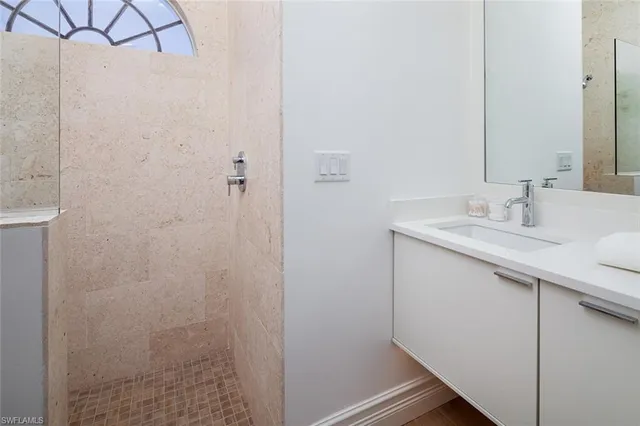 a bathroom with a sink and a mirror
