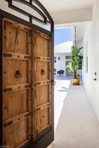 a hallway with a door in front of it