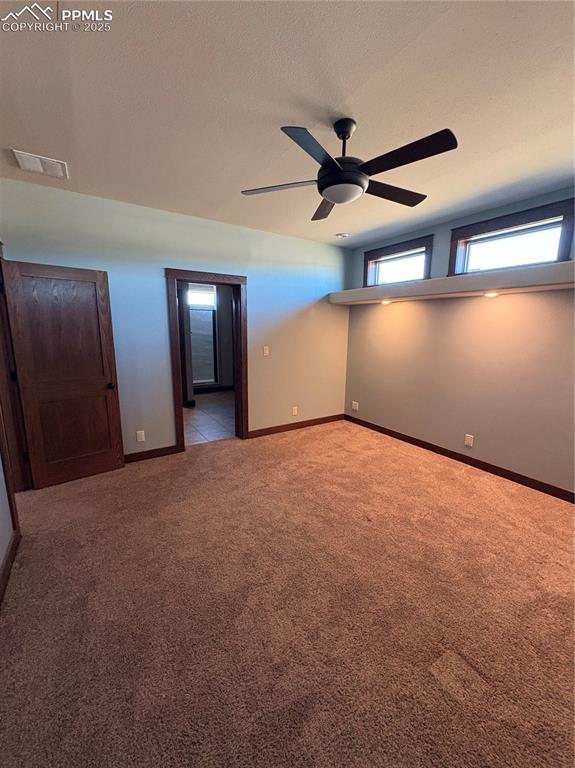 1925 Doe Valley Road Guffey, CO 80820 - Photo 10 of 30 a view of a livingroom with a ceiling fan and window