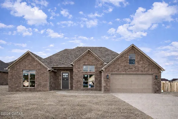 front view of a house with yard