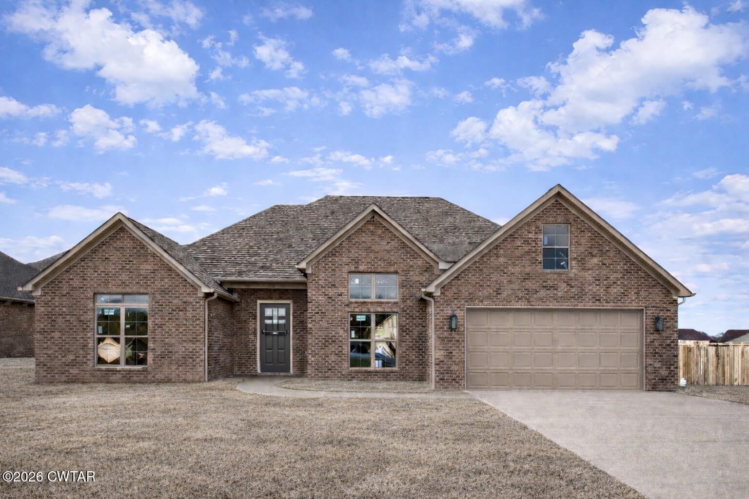 front view of a house with yard