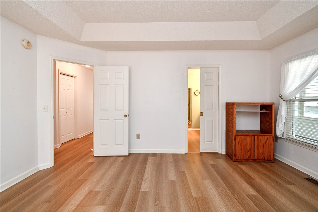103 Baldwin Place Easley, SC 29642 - Photo 40 of 42 This bright room features a tray ceiling and beautiful wood flooring.