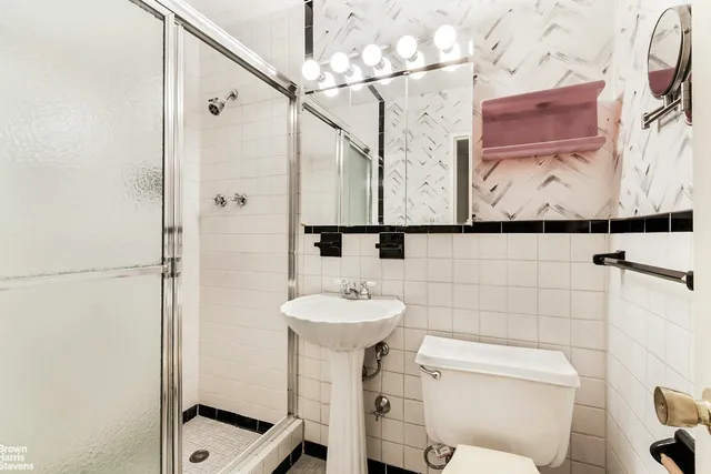 a bedroom with a bed and a table in it