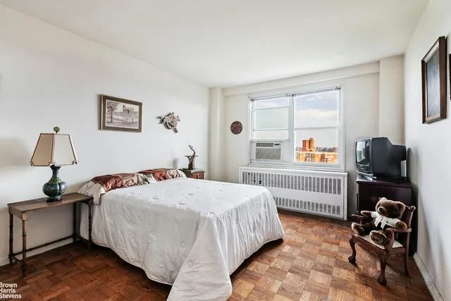 a bathroom with a sink mirror and toilet