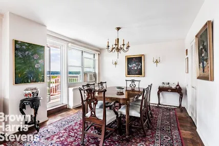 a view of a dining room with furniture window and outside view