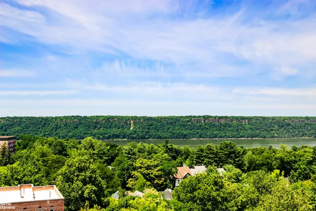 a view of a balcony with city view