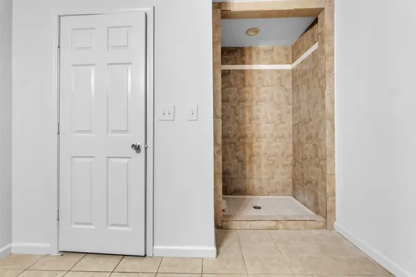 a bathroom with a sink mirror and vanity