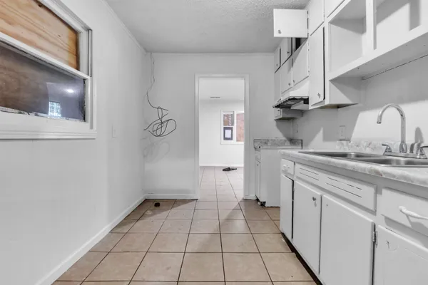 a view of a hallway with a white walls