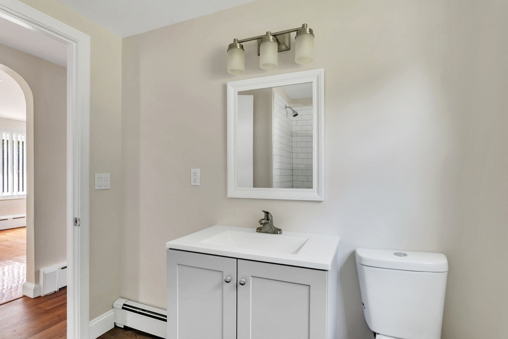 800 Wilbraham Road Springfield, MA 01109 - Photo 12 of 21 a bathroom with a sink a toilet and a mirror