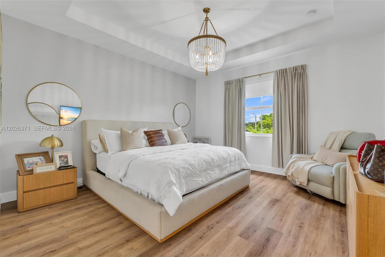 2273 Northwest 131st Circle Miami, FL 33167 - Photo 24 of 46 a bedroom with a bed and a chandelier