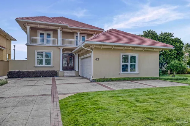 a front view of a house with yard