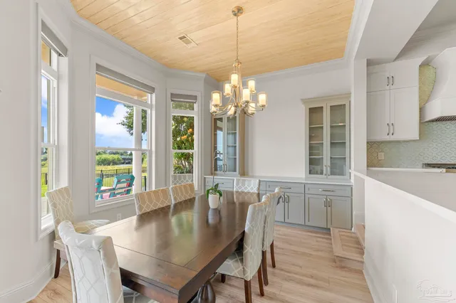 a kitchen that has a sink a stove and a refrigerator