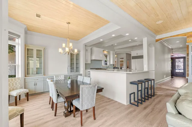 a kitchen with stainless steel appliances a sink stove and cabinets