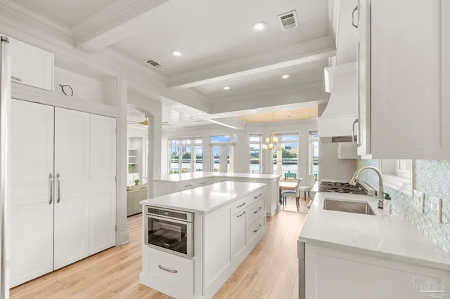a utility room with sink dryer and washer