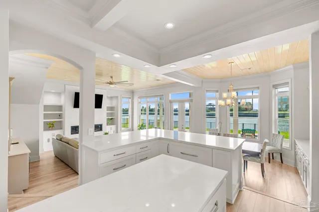 a spacious bedroom with a large bed and a large window