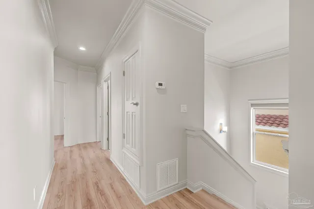 a spacious bathroom with a large tub sink and double vanity