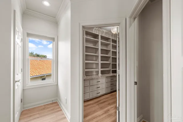 a house with potted plants in front of main door
