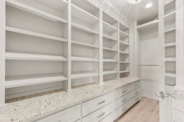 a view of a lake with houses in the back