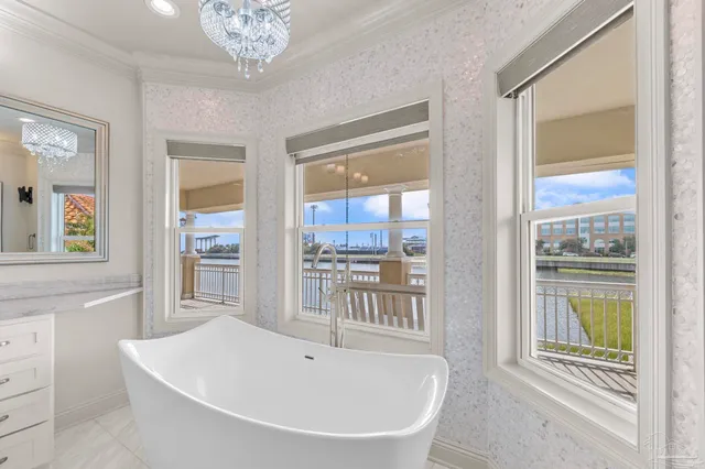 an aerial view of house with yard swimming pool and ocean view