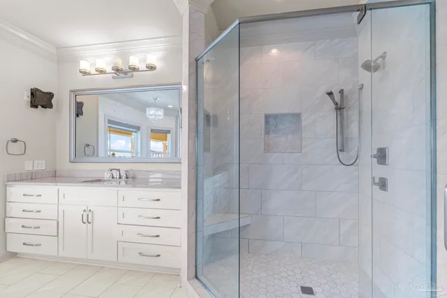 an aerial view of residential houses with outdoor space and swimming pool