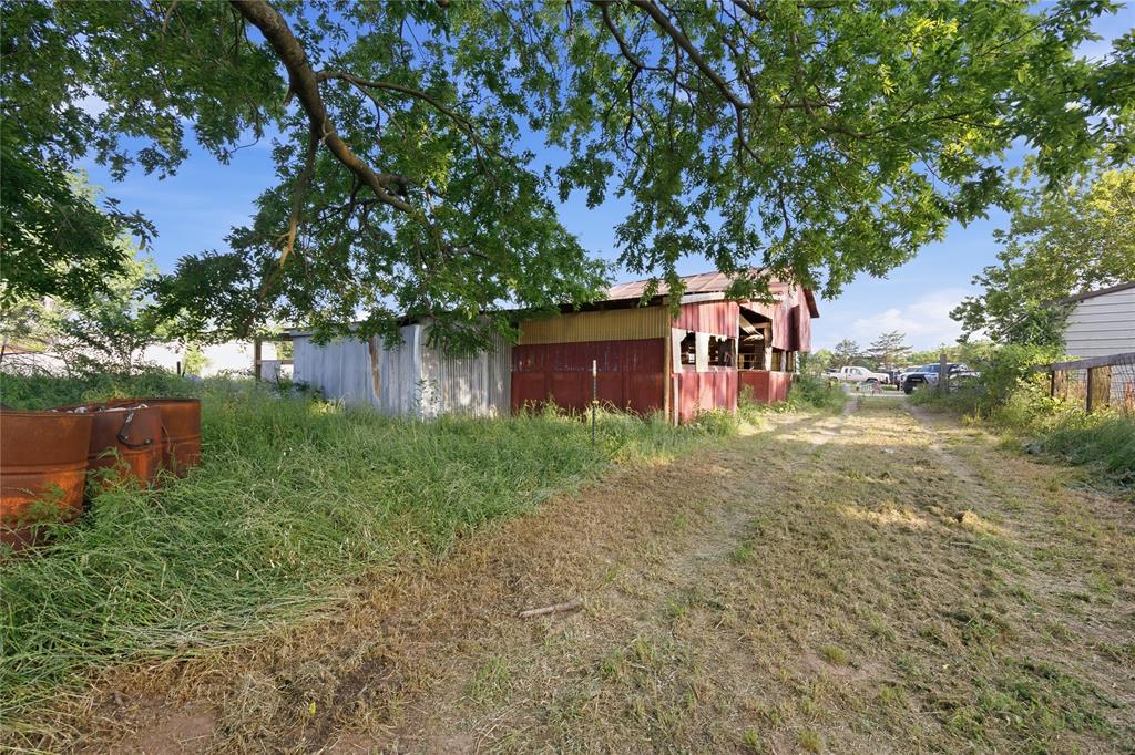 2449 East Fm 120 Denison, TX 75021 - Photo 10 of 30 a backyard of a house with lots of green space and lake view