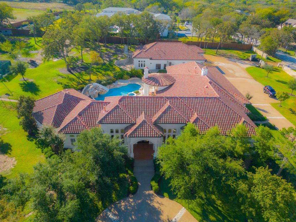 1075 West Dove Road Southlake, TX 76092 - Photo 1 of 1 an aerial view of house with swimming pool yard and outdoor seating