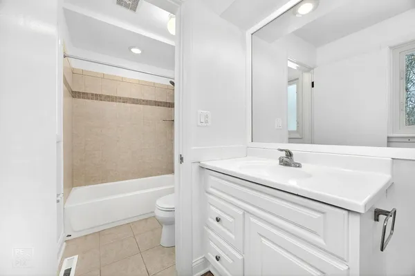 a bathroom with a sink a toilet and a bathtub