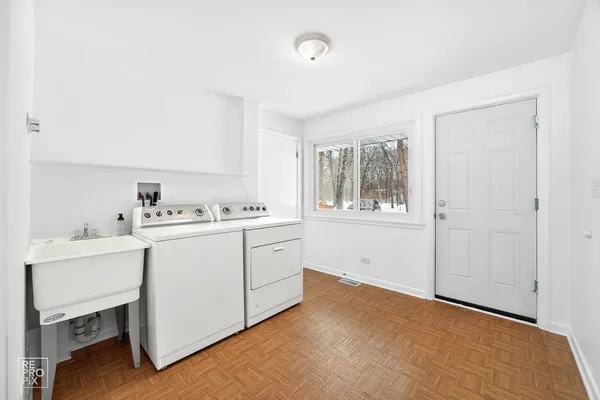 a kitchen with a white cabinets and sink