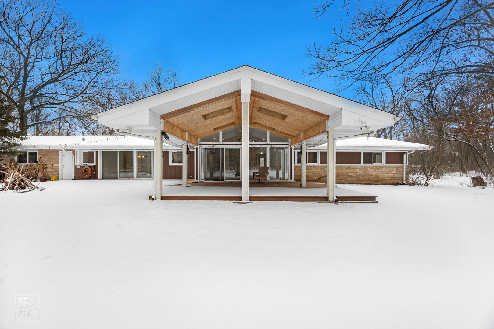 23670 North Elm Road Lincolnshire, IL 60069 - Photo 34 of 36 a view of a house with a large window and balcony