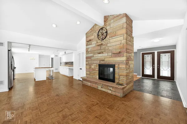 a view of livingroom and fireplace with furniture