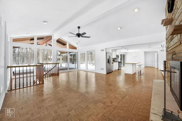 a view of an entryway with wooden floor