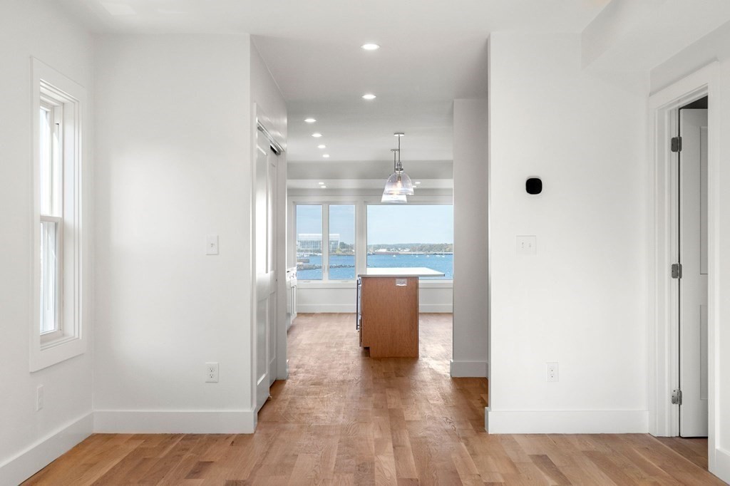 a view of kitchen with furniture and wooden floor