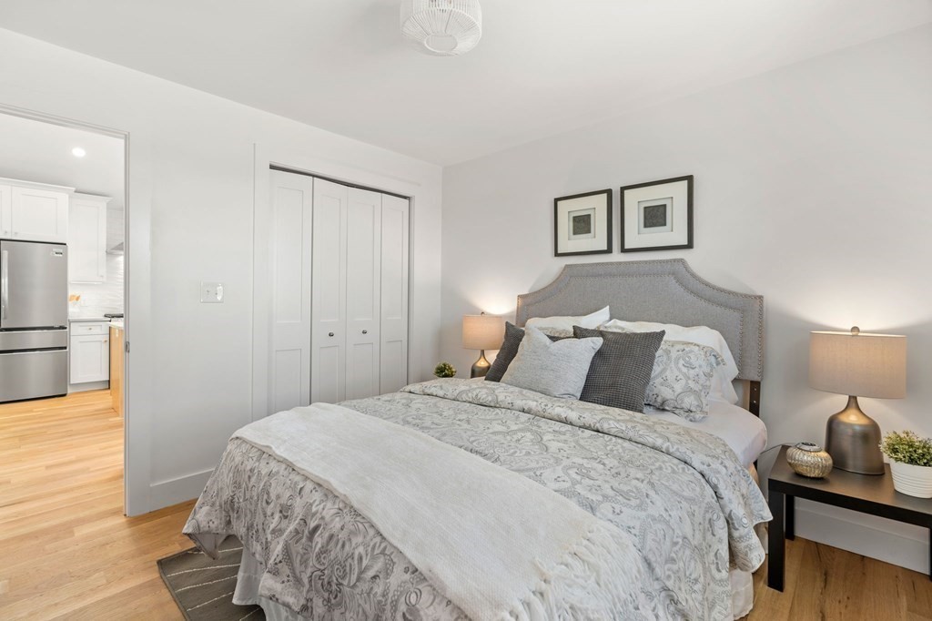 111 Leach Street, Unit 1 Salem, MA 01970 - Photo 20 of 32 a bedroom with a bed and a table