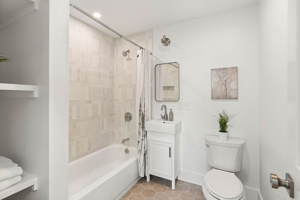 111 Leach Street, Unit 1 Salem, MA 01970 - Photo 22 of 32 a bathroom with a toilet sink and shower