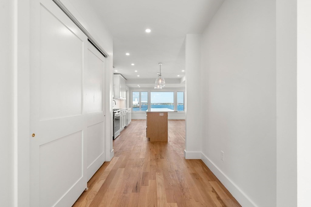 111 Leach Street, Unit 1 Salem, MA 01970 - Photo 9 of 32 a view of a hallway with wooden floor
