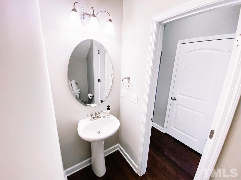 7989 Creech Road Middlesex, NC 27557 - Photo 7 of 20 a bathroom with a sink and a mirror