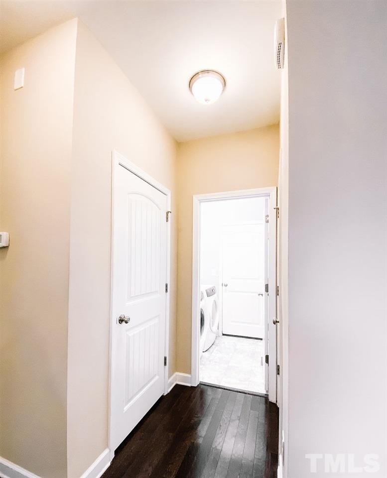 7989 Creech Road Middlesex, NC 27557 - Photo 8 of 20 a view of a hallway with wooden floor