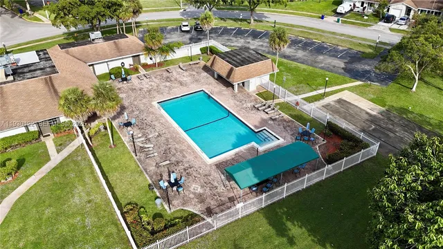 an aerial view of a house with a garden